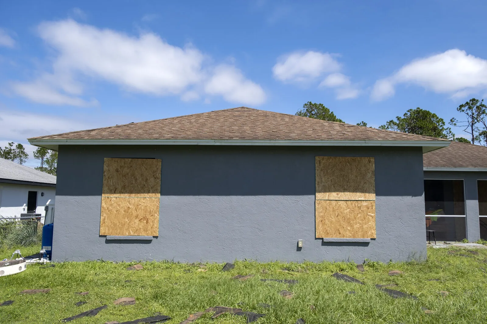 Florida home with windows boarded up