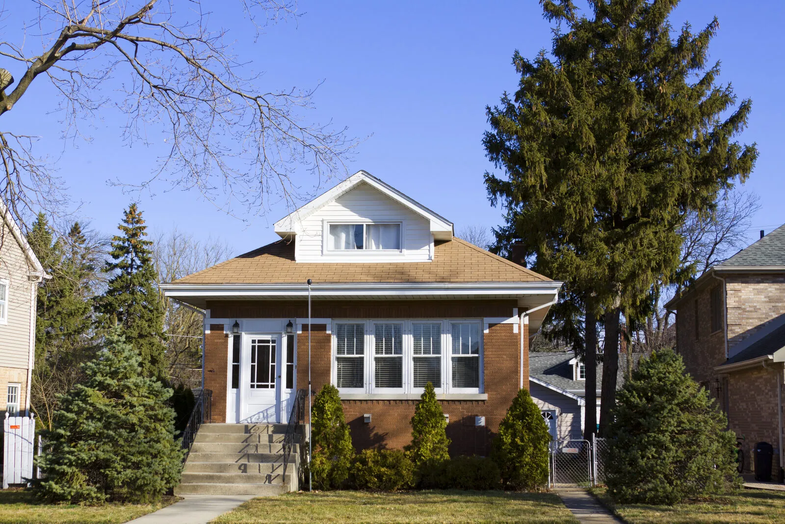 Two-story bungalow home with a front porch