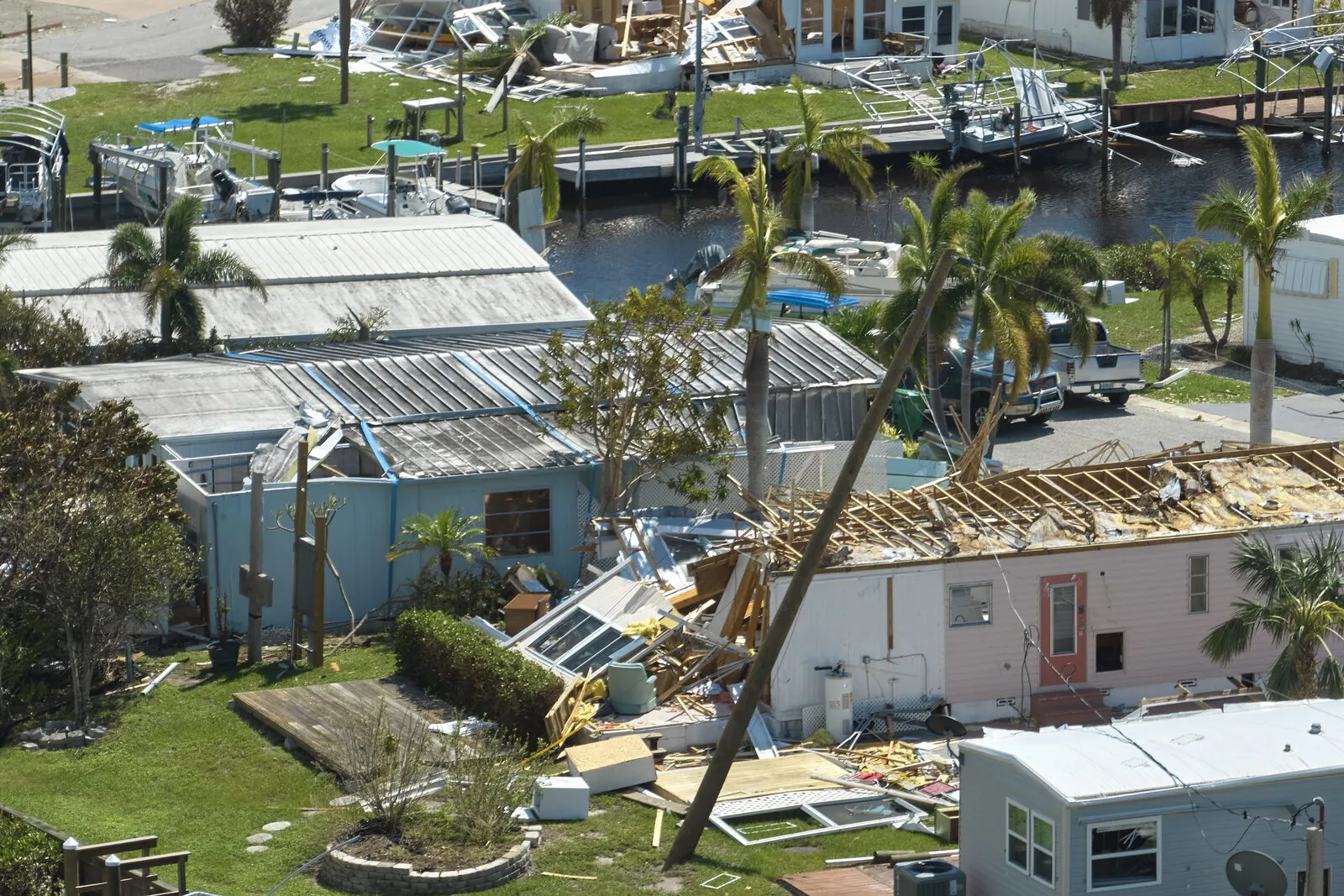 Florida neighborhood with storm-damaged homes seen from above